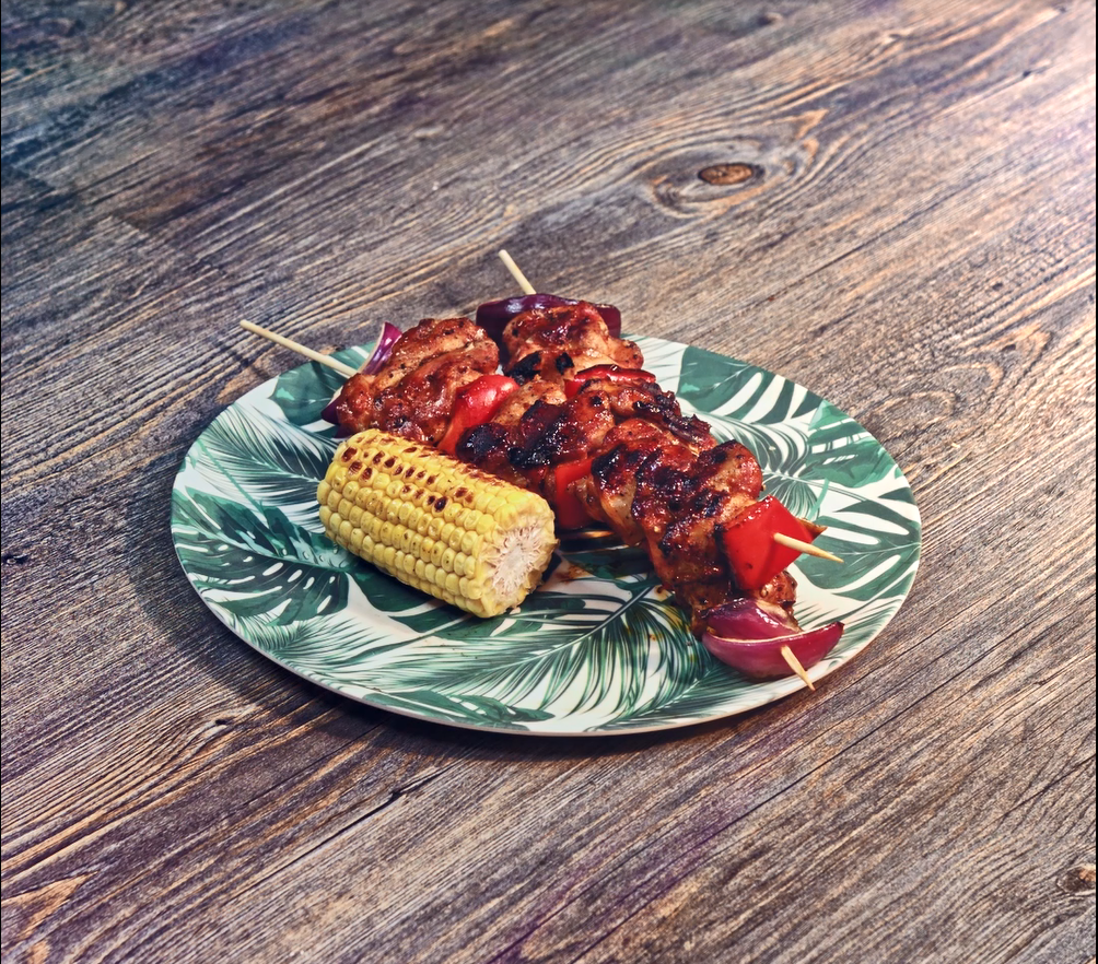 Chicken skewers served on plate