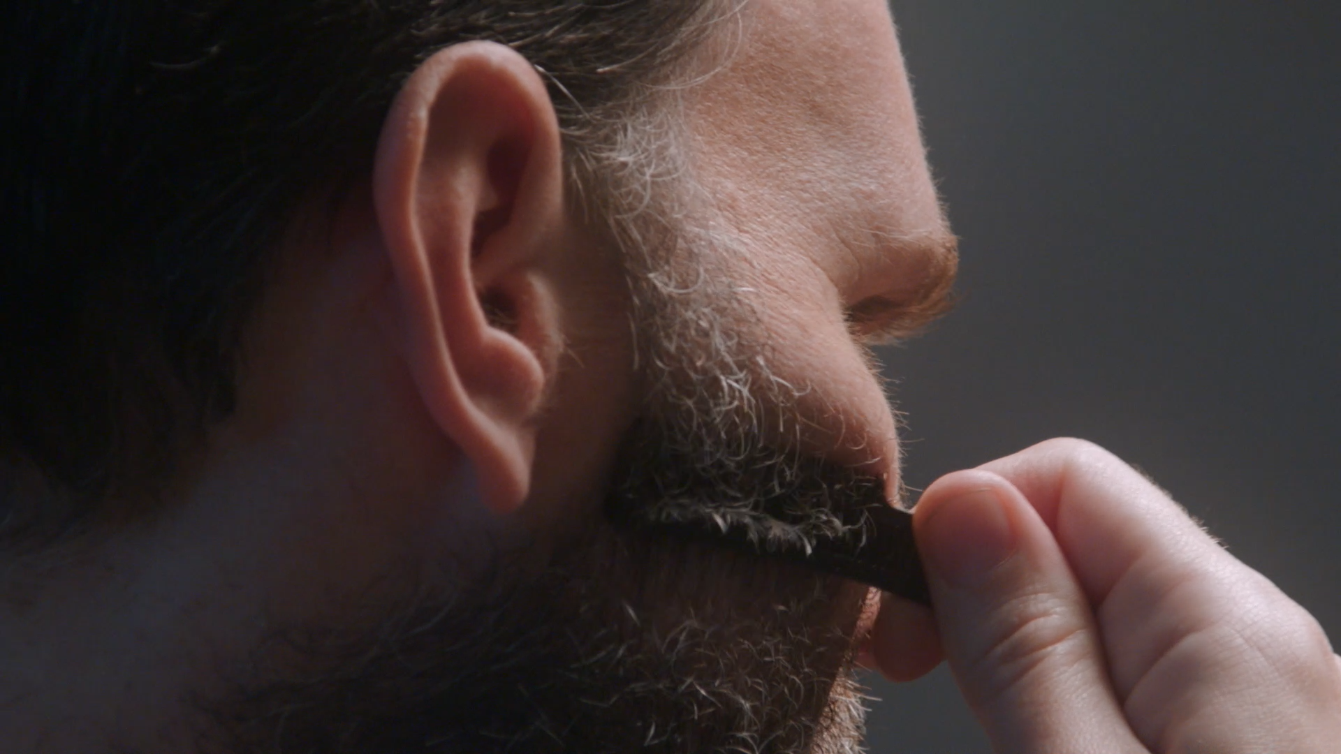 Man shaping beard