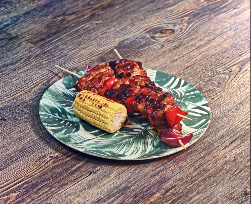 Chicken skewers served on plate