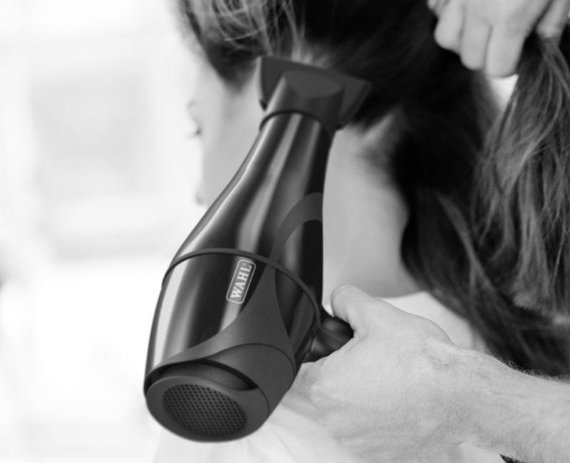 Hairdresser using the Wahl Keratin Dryer on a client
